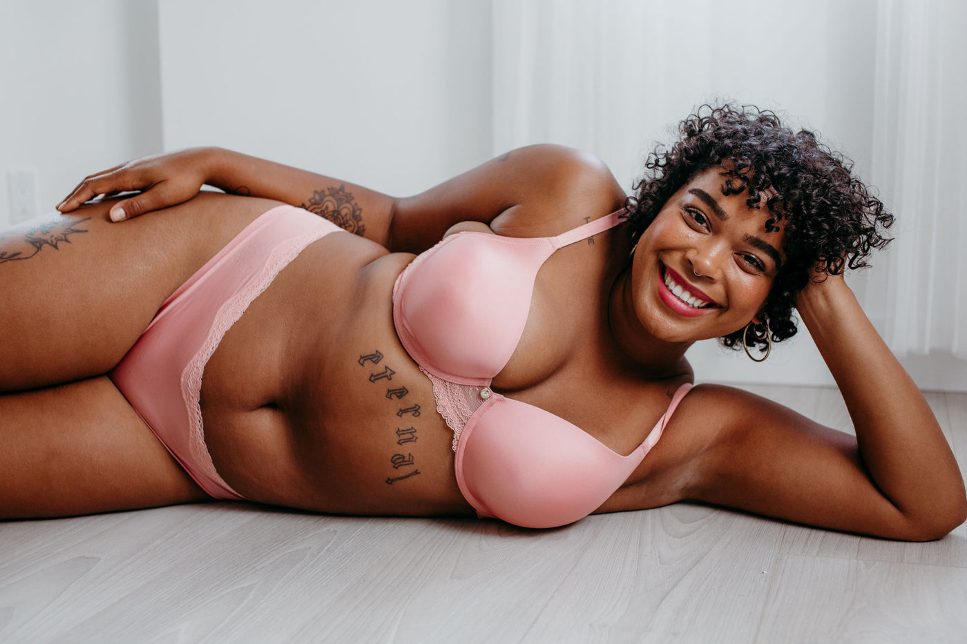 Woman lying down wearing pink contour bra and underwear, comfortable lingerie Canada online