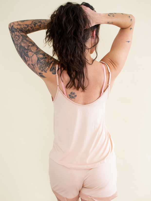 Woman wearing bamboo v neck camisole & shorts set in pink, back