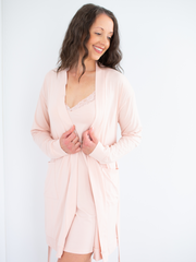 Woman wearing women's sleepwear bamboo robe in pink, front open