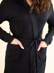 Woman wearing women's sleepwear bamboo robe in black, close-up front