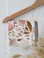 Organic cotton face cloth in pink floral, hanging