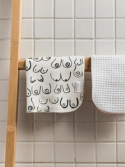Organic cotton face cloth in white, hanging