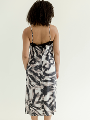 Woman wearing a 100% silk slip from behind.