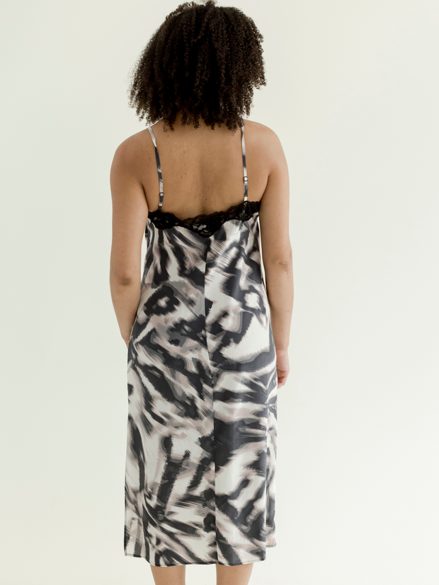Woman wearing a 100% silk slip from behind.